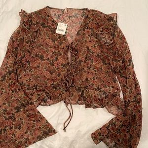 NWT Free People sheer top in muted colors of pinks, browns, & grays.